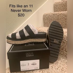 Never worn. Fits like a 10.5 or 11